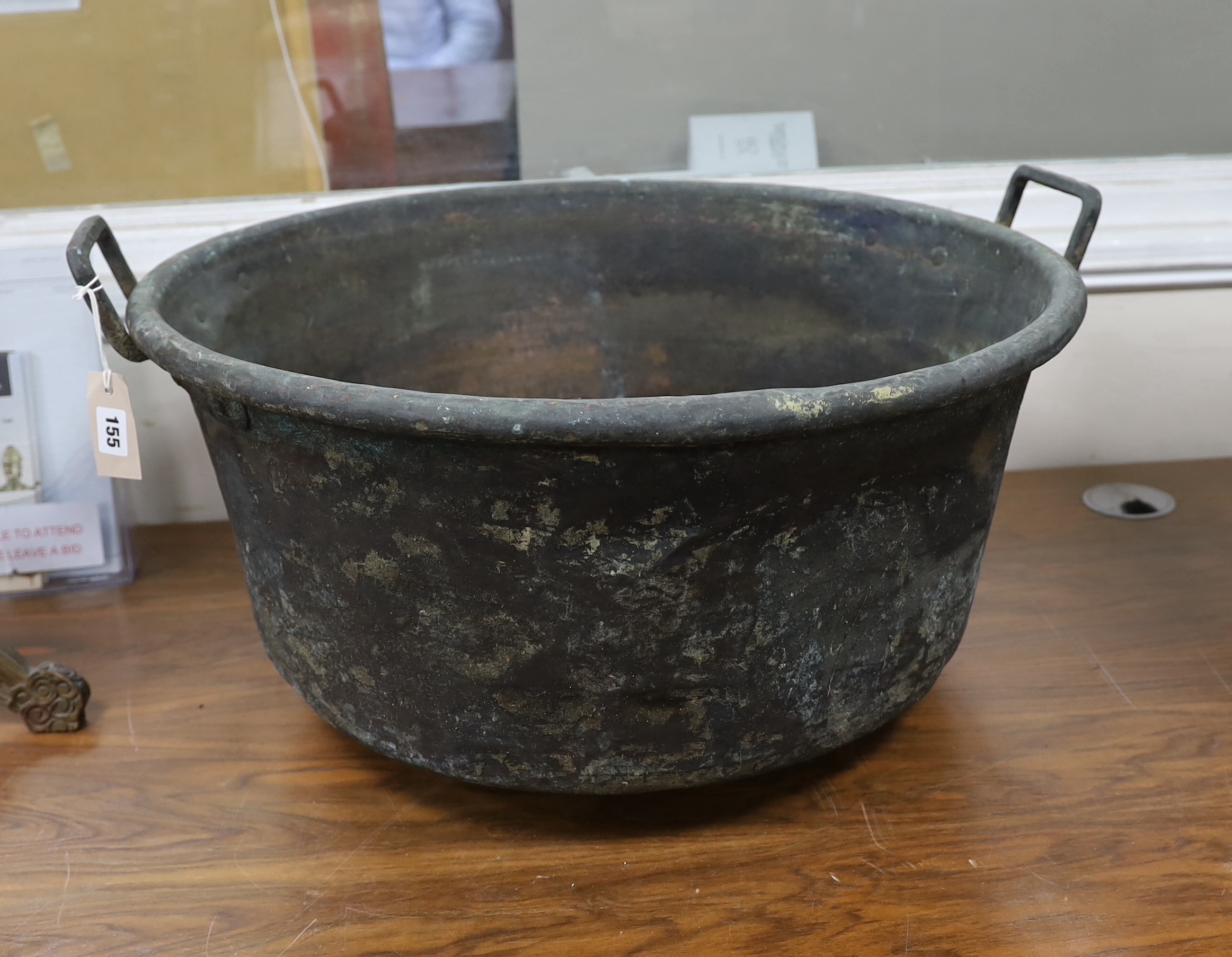 A Victorian circular two handled copper pan, diameter 66cm, height 33cm